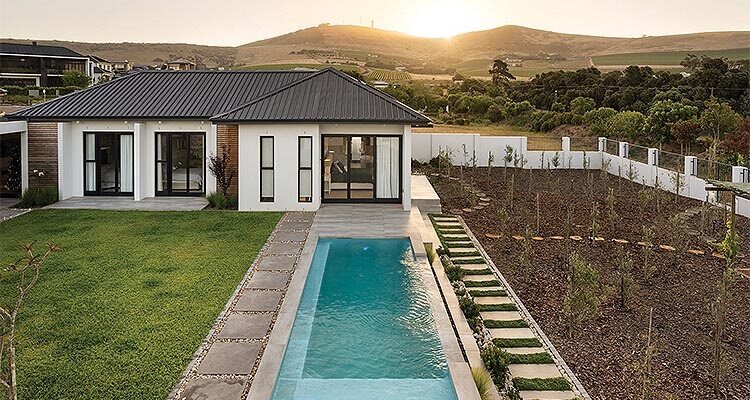 Exterior shot of a bungalow with a pool