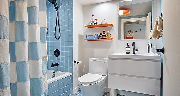 modern bathroom seamlessly blends the stark geometry of square shapes with a harmonious palette of complementary colors