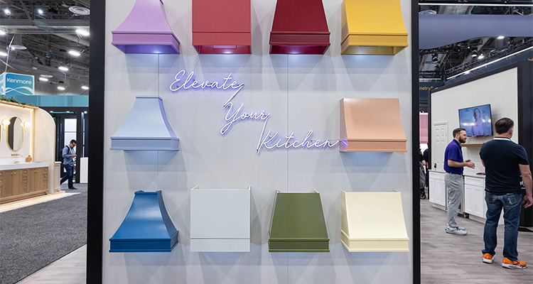 Brightly coloured extractor hoods in a display