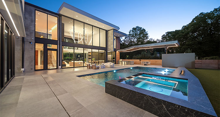 modern, luxury home with a large pool and spa area