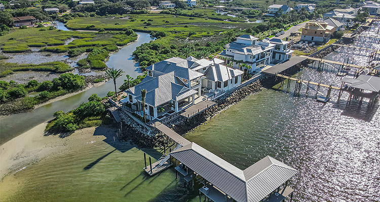 custom-built, luxurious coastal home by Glenn Layton Homes located on a waterfront lot
