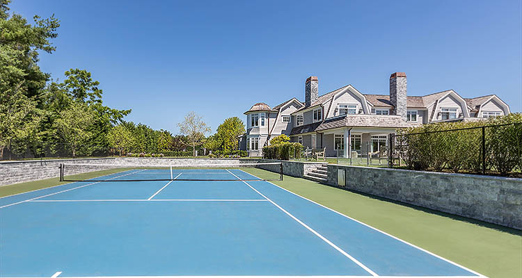 a luxury estate with a tennis court