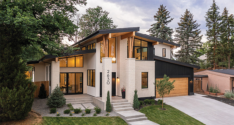 a modern, two-story house with a distinctive architectural style, likely featuring mid-century modern influences