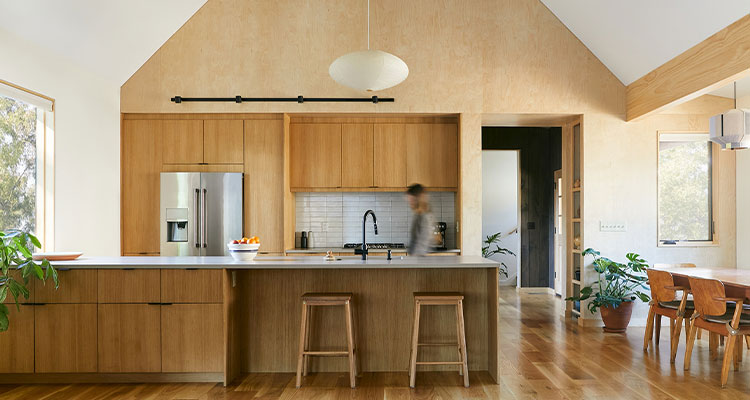a modern, open-concept kitchen and dining area with a minimalist design aesthetic