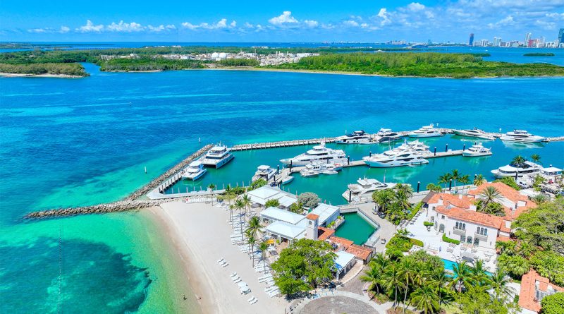 Aerial view of Fisher Island showing luxury condos and waterfront estates near Miami