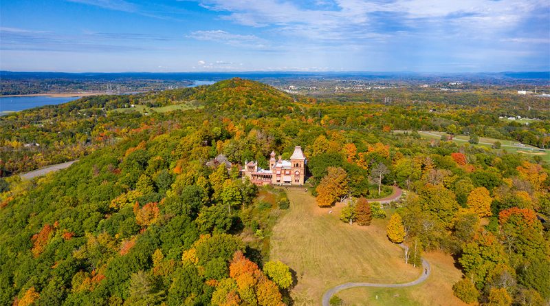 Aerial view of a 19th-century mansion on a large estate in Millbrook New York surrounded by green lawns and trees