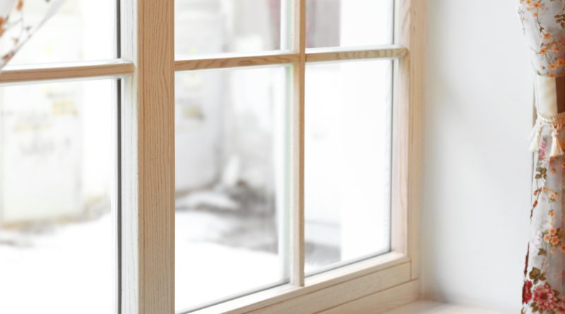 Large wooden window with beautiful curtains in sunny day