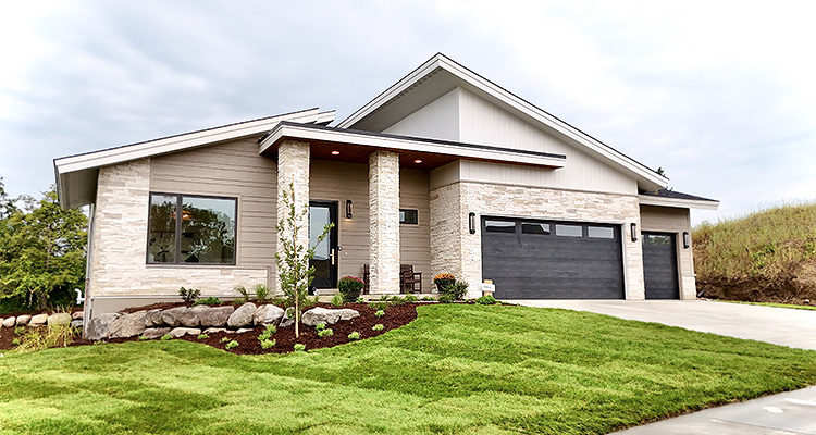 a modern, single-story house with a mix of architectural styles