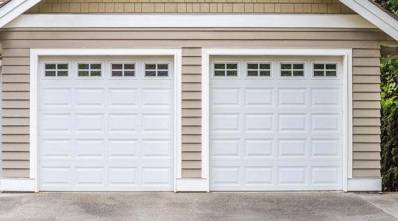 White garage doors on house