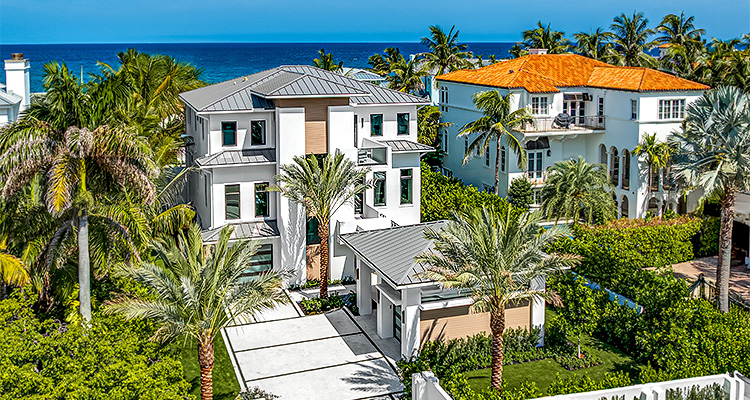 a brand-new coastal modern home featuring a transitional style and offers ocean views from every level.