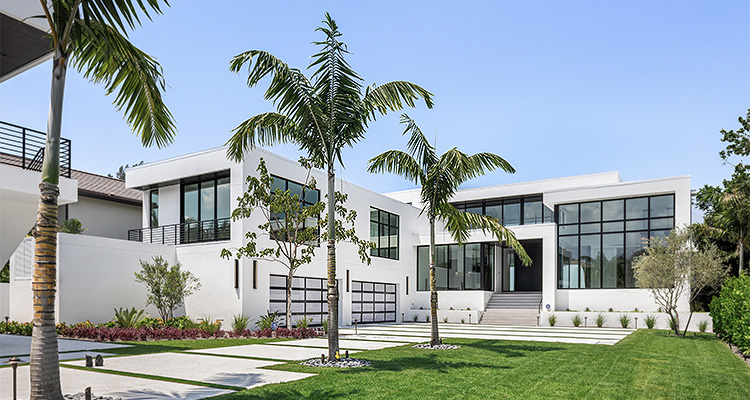 contemporary or modern architectural style house with a clean white exterior and large expanses of glass
