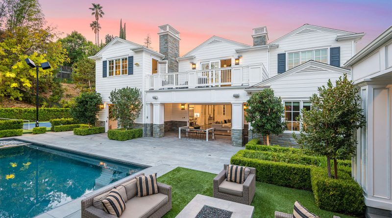 Exterior of Blackbear’s redesigned Encino mansion with modern farmhouse styling and gated entry