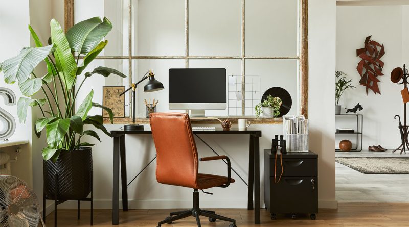 Modern home office with ergonomic chair, wooden desk, natural lighting and indoor plants